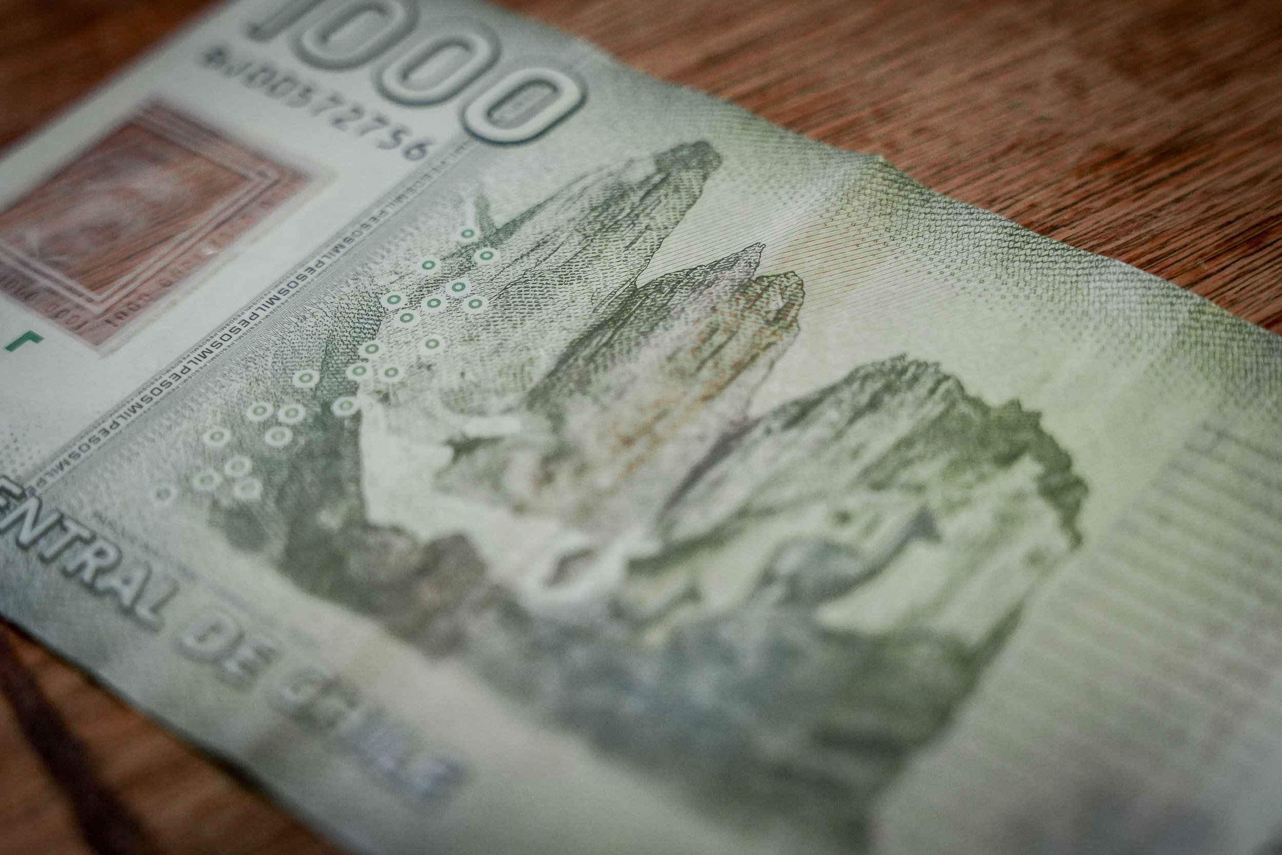 Panoramic view of the Base Torres in Torres del Paine National Park, Chile, with three granite towers rising above a glacial lake in Patagonia.