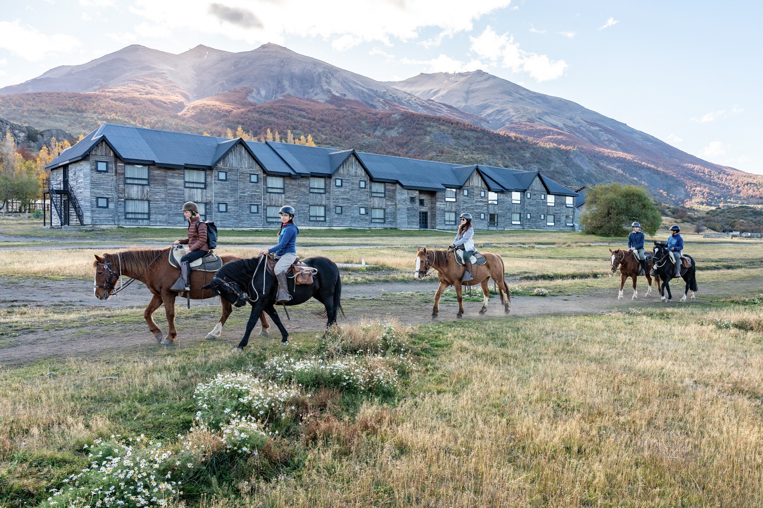 Horseback riding excursion at Hotel Las Torres exploring the eastern side of Torres del Paine National Park, following the O Circuit trails with views of Paine Massif, Azul Lagoon, Cerro Paine, lenga beech forests, rivers, pampas, and Encantado Valley.